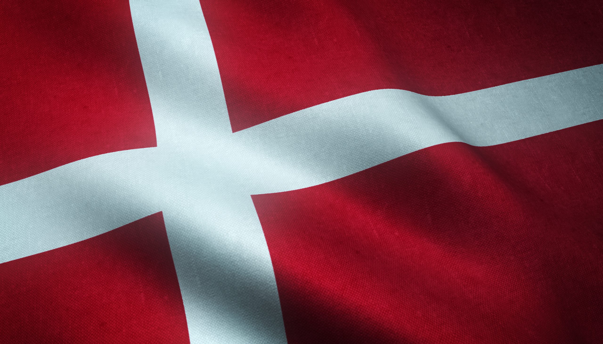 A closeup shot of the waving flag of Denmark with interesting textures